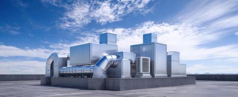 The industrial cooling system on a rooftop against a clear blue sky photo