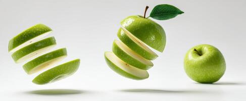 The Green Apple Sliced into Floating Segments Against a White Background photo