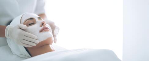 A woman getting a facial treatment photo