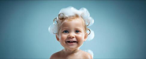 The joyful baby smiling with soap bubbles in playful bath setting. photo