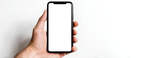 The smartphone held in a person's hand against a white background. photo