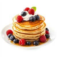 A stack of fluffy pancakes, drizzled with maple syrup and topped with fresh berries and whipped photo