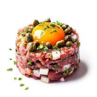 A finely presented image of a steak tartare, featuring raw ground beef mixed with capers, onions, photo