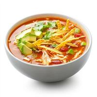 A close-up of a warm bowl of tortilla soup, with a flavorful tomato-based broth, shredded chicken, photo