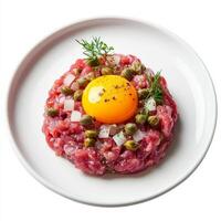 A plate with meat and an egg on top photo