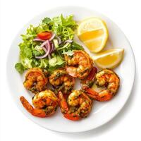 A plate of prawn cafreal, with prawns marinated in a green masala and fried until crispy, served photo