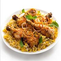 A plate of chicken biryani, with tender pieces of chicken cooked with aromatic basmati rice, saffron photo
