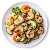 A plate of shrimp and scallop aguachile, shrimp and scallops marinated in lime juice, with cucumbers photo