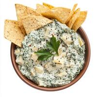 A bowl of spinach and artichoke dip, with a creamy blend of spinach, artichokes, cream cheese, photo