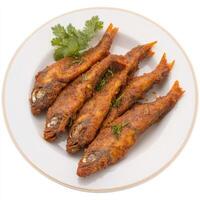 A plate of fish amritsari, with fish marinated in spices and gram flour, fried until crispy, photo
