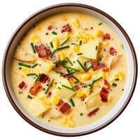 A bowl of corn and bacon soup with a side of bacon photo