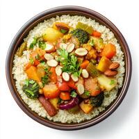 An image of a colorful vegetable tagine, served with fluffy couscous and garnished with fresh herbs photo