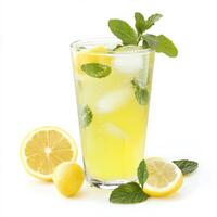 A glass of nimbu pani, with a refreshing drink made from lemon, sugar, and water, garnished with mint leaves and ice, isolated on clean white background. photo