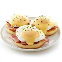 An enticing shot of a plate of eggs benedict, featuring poached eggs, Canadian bacon, and hollandaise sauce, served on an English muffin. The eggs benedict, with their rich, creamy sauce and perfectly photo