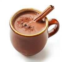 A close-up of a refreshing champurrado, a thick Mexican hot chocolate drink, made with corn masa, chocolate, cinnamon, and piloncillo, served in a mug and garnished with a cinnamon stick, isolated on photo