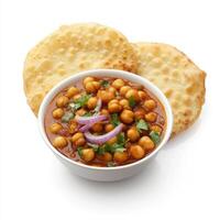 A bowl of chana masala, with chickpeas cooked in a spicy tomato and onion sauce, served with bhatura bread, isolated on clean white background. photo