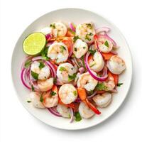 A plate of shrimp and scallop ceviche, shrimp and scallops marinated in lime juice, with red onions, cilantro, and serrano peppers, served cold, isolated on clean white background. photo