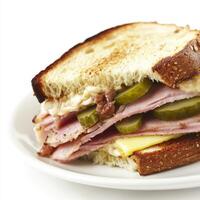 A meticulous close-up of a plate of a Cuban sandwich, featuring roasted pork, ham, Swiss cheese, pickles, and mustard on Cuban bread, pressed until crispy. The Cuban sandwich, with its savory fillings photo