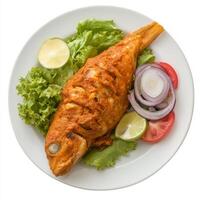 A plate of fish recheado, with fish stuffed with a spicy masala and fried until crispy, served with salad, isolated on clean white background. photo