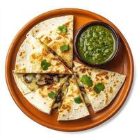 A plate of cheesy quesadillas, filled with melted Oaxaca cheese, mushrooms, and epazote, grilled until golden brown and served with a side of salsa verde, arranged on a terracotta plate, isolated on photo
