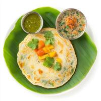 A plate with a crepe and some vegetables on it photo