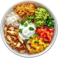 A plate of chicken fajita bowls, chicken fajitas served in a bowl, with rice, beans, guacamole, salsa, and sour cream, topped with fresh cilantro, arranged on a wooden table setting, isolated on clean photo