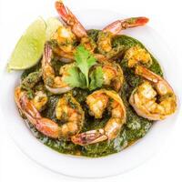 A plate of prawn cafreal, with prawns marinated in a green masala and fried until crispy, isolated on clean white background. photo