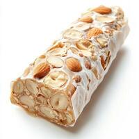 A close-up of a sweet and sticky torrone dessert, an Italian nougat candy, made with honey, sugar, egg whites, and nuts, such as almonds or hazelnuts, served sliced and wrapped in wafer paper, a photo