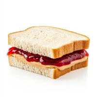 A classic peanut butter and jelly sandwich made with soft white bread. The creamy peanut butter and sweet strawberry jam ooze slightly from the edges, creating a nostalgic childhood favorite. Isolated photo