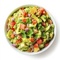 A bowl of fresh guacamole made with ripe avocados, diced tomatoes, red onions, cilantro, and lime juice. The creamy texture is enhanced by the vibrant mix of ingredients, ready to be served with photo