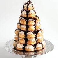 A close-up of a profiterole tower, a towering stack of small cream puffs, filled with vanilla pastry cream and drizzled with chocolate sauce, a festive and impressive French dessert, perfect for photo