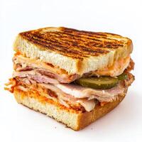 A close-up of a Cuban sandwich, enriched with the tangy and spicy flavours of Korean kimchi, featuring roasted pork, ham, Swiss cheese, pickles, and kimchi mayo, served on grilled Cuban bread, a photo