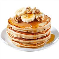 A stack of fluffy banana pancakes, drizzled with honey and topped with chopped walnuts and fresh banana slices. A sweet and hearty breakfast favorite. Isolated on clean white background photo