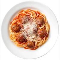 A plate of spaghetti alla chitarra, featuring square-shaped spaghetti made on a guitar-like tool, tossed with a simple tomato sauce and meatballs, a classic Abruzzese dish, garnished with grated photo