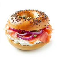 A gourmet bagel sandwich filled with smoked salmon, cream cheese, capers, and thinly sliced red onions. The bagel is golden and slightly crisp, making for a satisfying breakfast or brunch option. photo