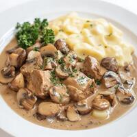 Mushroom and beef stew with mashed potatoes photo