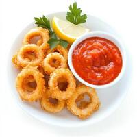 A plate of crispy fried calamari rings, served with a side of marinara sauce and a wedge of lemon. A delicious seafood appetizer. Isolated on clean white background photo