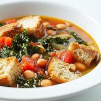 A close-up of a warm and comforting ribollita soup, a hearty Tuscan bread and vegetable soup, with beans, kale, tomatoes, and crusty bread, simmered until thick and flavorful, garnished with a drizzle photo