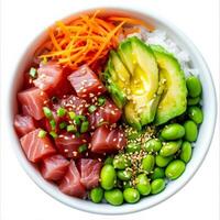 A fresh poke bowl filled with diced raw tuna, sushi rice, edamame, avocado slices, and shredded carrots. The ingredients are drizzled with a sesame-soy sauce and sprinkled with sesame seeds for extra photo