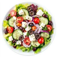 A colorful Greek salad with crisp lettuce, cucumbers, cherry tomatoes, Kalamata olives, red onions, feta cheese, and a lemon-oregano dressing. A Mediterranean delight. Isolated on clean white photo