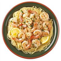 A plate of spaghetti with shrimp and lemon photo