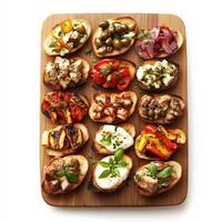 A vibrant platter of assorted crostini, featuring grilled bread topped with various toppings, such as chicken liver pate, olive tapenade, roasted vegetables, and fresh mozzarella, perfect for an photo