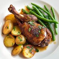 A plate with potatoes, green beans and a chicken photo