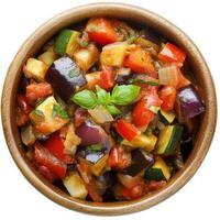 A close-up of a classic ratatouille, a colorful vegetable stew with eggplant, zucchini, bell peppers, tomatoes, onions, and herbs, simmered until tender and flavorful, served in a rustic bowl, photo