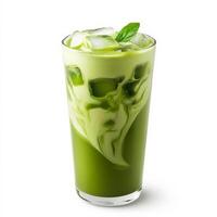 A tall glass of iced matcha latte, with a vibrant green color and swirls of creamy milk blending in. The drink is garnished with ice cubes, making it a refreshing treat. Isolated on clean white background photo