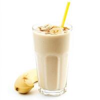 A glass of milk with a banana and a straw photo