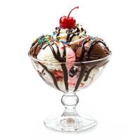 A decadent ice cream sundae in a glass dish, featuring scoops of vanilla, chocolate, and strawberry ice cream, drizzled with chocolate sauce, whipped cream, sprinkles, and a cherry on top. A delightful dessert. Isolated on clean white background photo