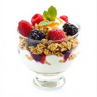 A glass bowl filled with yogurt, berries, and granola photo