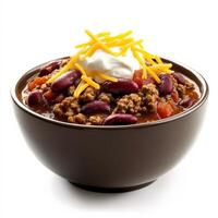 A bowl of hearty chili with ground beef, kidney beans, tomatoes, and a blend of warm spices. Topped with shredded cheese and a dollop of sour cream for extra richness. Isolated on clean white background photo
