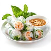 A plate of fresh spring rolls wrapped in rice paper, filled with shrimp, vermicelli noodles, lettuce, and mint, served with a peanut dipping sauce. A healthy and refreshing appetizer. Isolated on clean white background photo